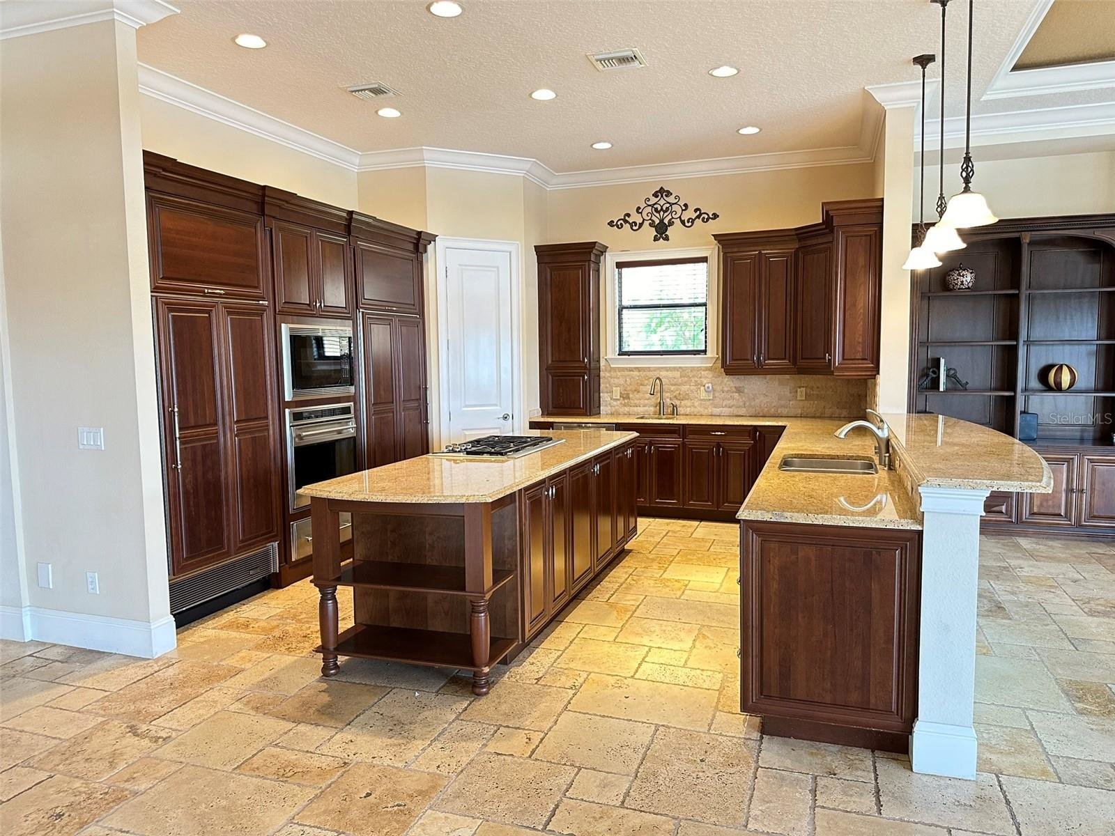 kitchen with wooden cabinets and large island